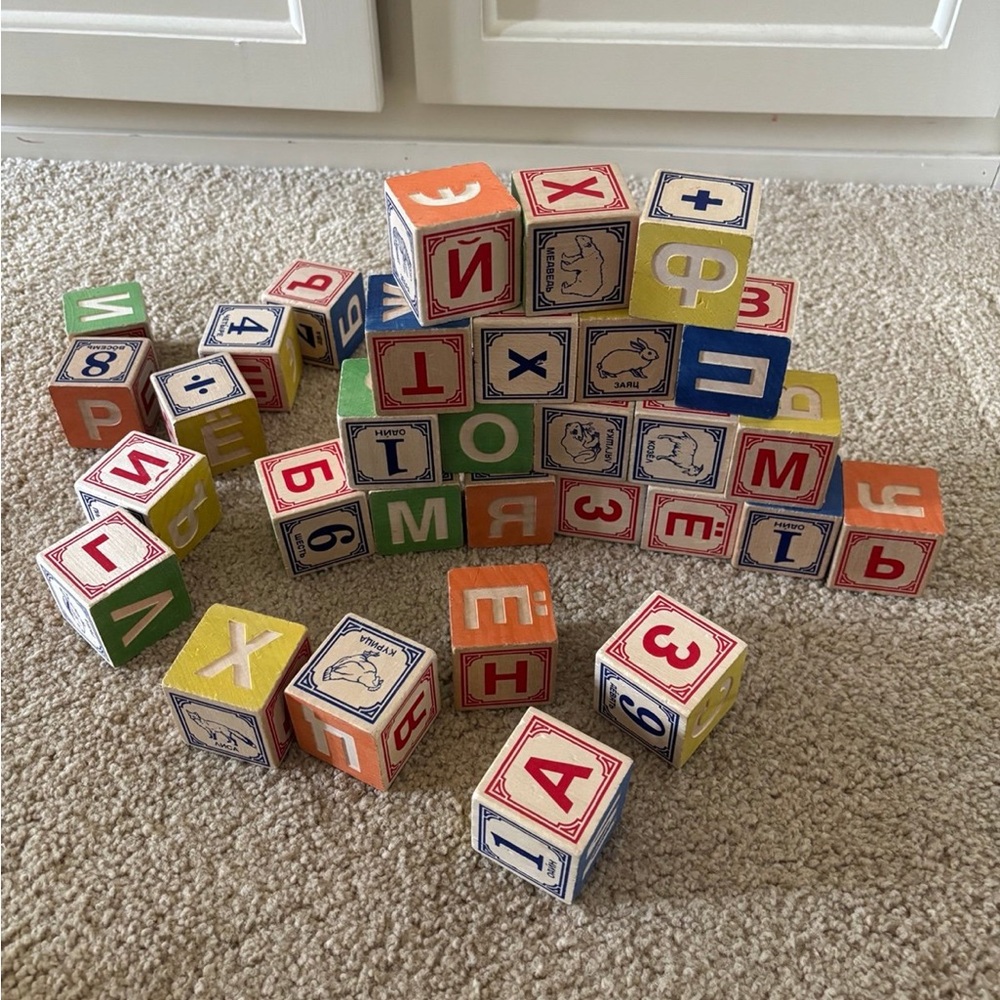 Russian/english language wood play blocks. In good used condition.